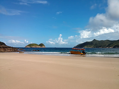 yellow boat on seashore thumbnail
