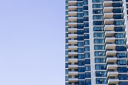architectural photography of blue and white building thumbnail