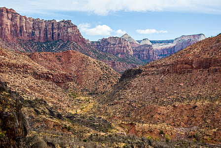 rocky mountains under blue sunny cloudy sky thumbnail