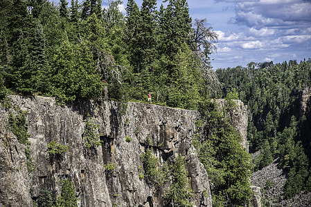 Man standing on the bluff at Ouimet Canyon Provincial Park, Ontario thumbnail