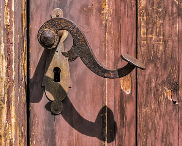 black door lever and keyhole on door thumbnail