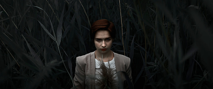 woman in green grass field thumbnail