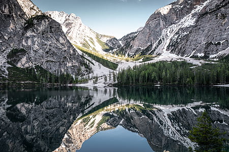 mountain with snow near lake thumbnail