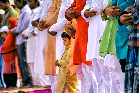 selective focus photography of boy praying thumbnail