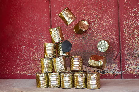 stone hitting pile of cans thumbnail