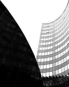 gray glass building under gray sky thumbnail