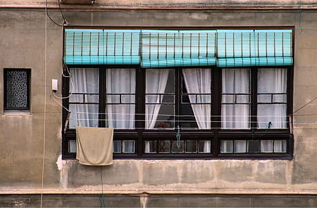 photo of three blue window blinds on windowpane thumbnail