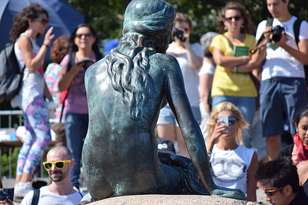 The Little Mermaid statue near people thumbnail