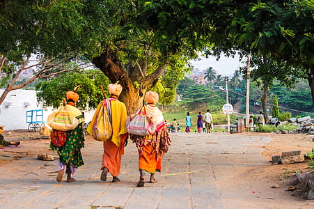 Three Person Walking on Concrete Road thumbnail