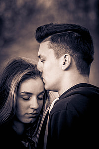 man kissing forehead of woman photography thumbnail