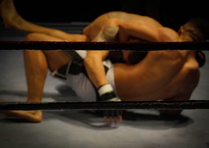 mixed martial artist fighting inside ring thumbnail