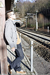man leaning on wall thumbnail