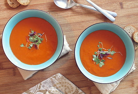 two bowls of tomato garnished soup thumbnail