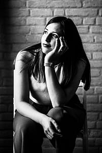 Grayscale Photo Of Woman Sitting On Chair thumbnail