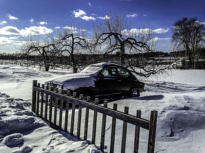Car in the snow in New Hampshire thumbnail