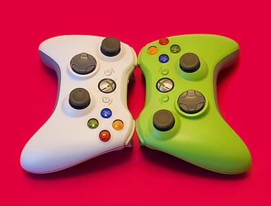 white and green Xbox game pads thumbnail