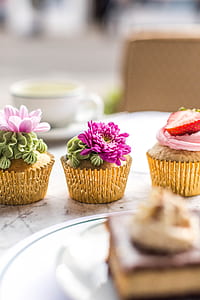 three cupcakes near plate thumbnail