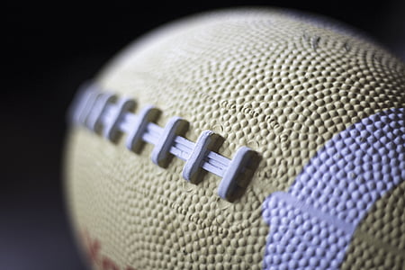 close up photo of yellow and white football thumbnail