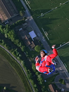 top-view photo of man in red top skydiving thumbnail