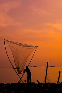 person standing near body of water thumbnail