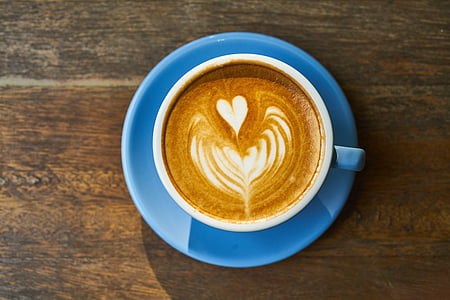 brown coffee with a heart design on a white ceramic mug thumbnail