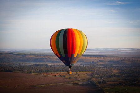 red, yellow and green hot air balloon on flight thumbnail