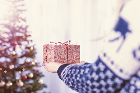 Woman’s hands hold christmas gift box. Merry Christmas thumbnail