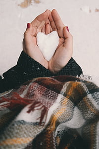 person holding heart-shaped ice thumbnail