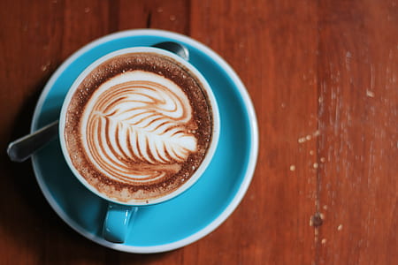 aerial photography of coffee in blue ceramic cup thumbnail