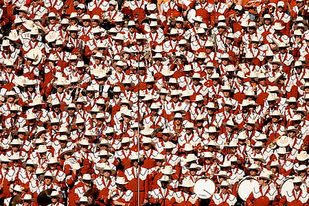 parade of people wearing white-and-red uniform at daytime thumbnail
