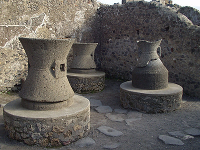 three gray concrete statues placed outside thumbnail