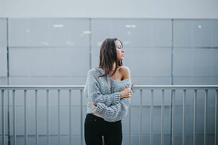 woman standing near the gray rail thumbnail