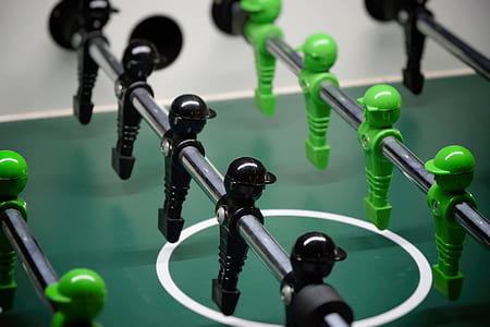 closeup photography of foosball table thumbnail