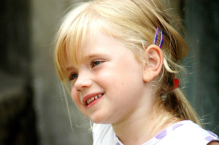girl in white and purple crew-neck shirt thumbnail