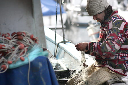 photography of man wearing red and brown sweater thumbnail