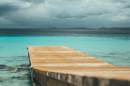 sea dock on calm body of water thumbnail