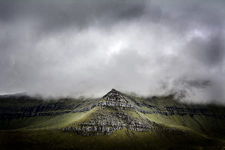 landscape photo of green mountain under cumulus clouds thumbnail