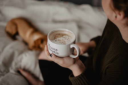 person holding cup thumbnail