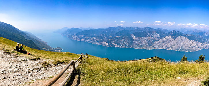 view of lake from a mountain during day time thumbnail