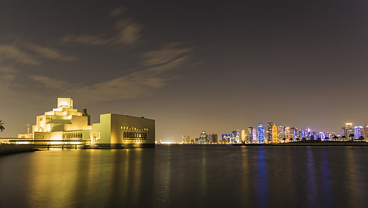 city buildings and white concrete building thumbnail