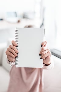 Woman Holding Blank Notebook thumbnail