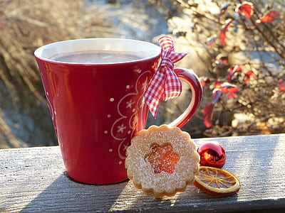 red ceramic mug with liquid on gray wooden plank thumbnail
