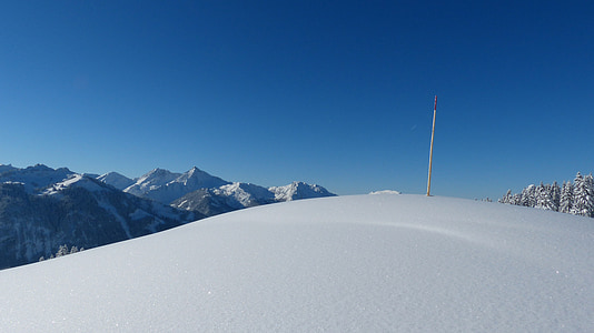 white hill near mountain ranges thumbnail
