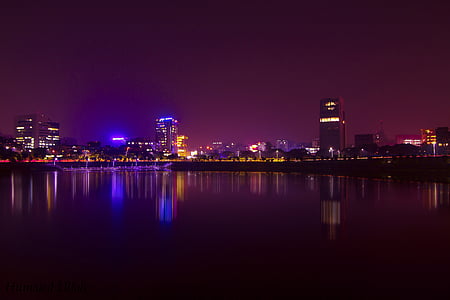 lighted city buildings during nighttime thumbnail