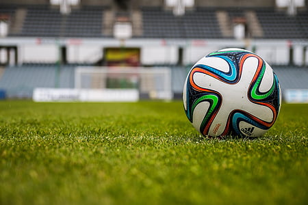 closeup photo of white, orange, black, and blue Adidas soccer ball thumbnail