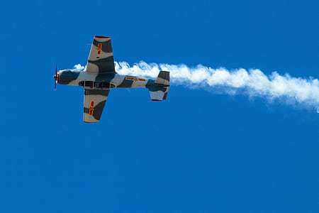 low angle photography of green and white airplane thumbnail