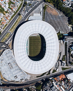 aerial view of stadium surrounded with buildings thumbnail