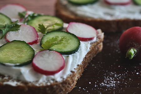 sliced bread with sliced fruits and cream on top thumbnail