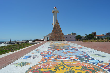 white concrete lighthouse near shore thumbnail