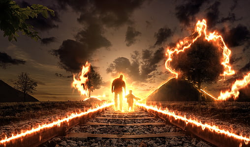 man and child walking on train trail thumbnail